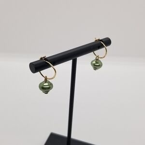 gold tone hoop earrings with green faux pearls